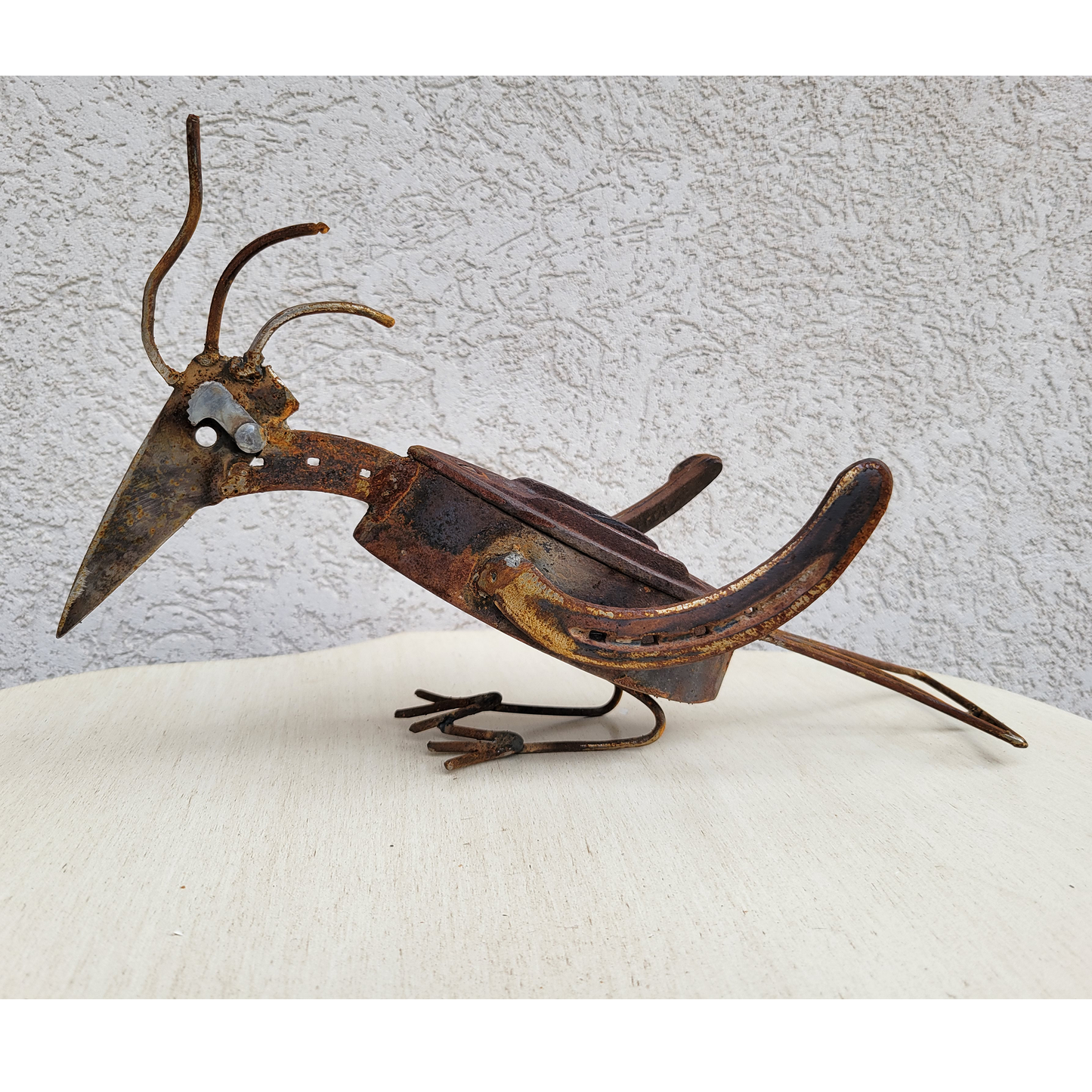 Woodpecker Using Antique Hand Iron And Horseshoes